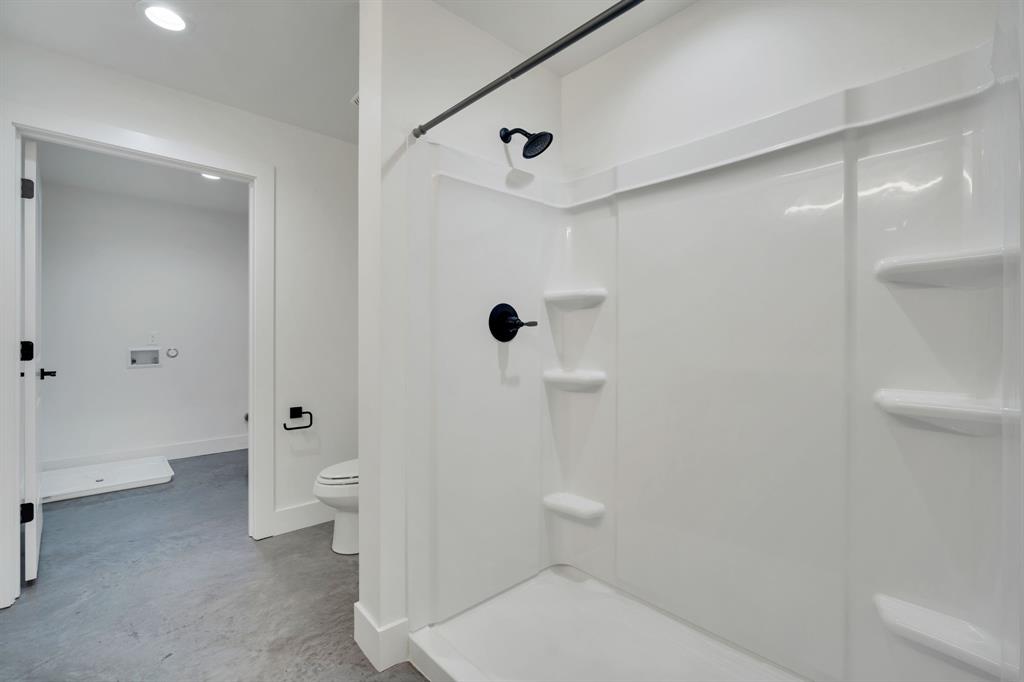 301 West Main Street, Unit 254 Midlothian, TX 76065 - Photo 8 of 18 a bathroom with a toilet a sink and shower