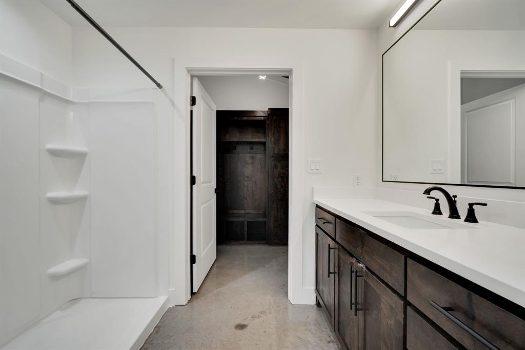 301 West Main Street, Unit 254 Midlothian, TX 76065 - Photo 9 of 18 a bathroom with a double vanity sink and mirror