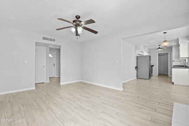 a view of a kitchen with a stove cabinets and wooden floor