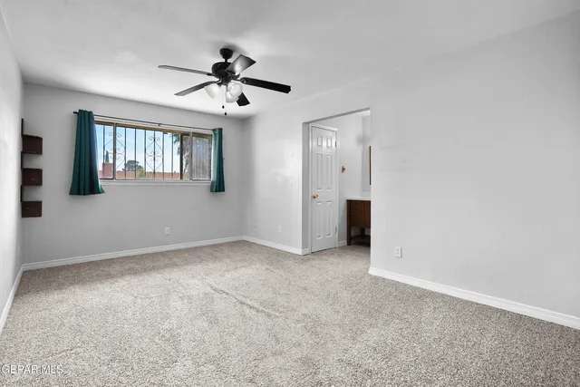 a view of a big room with carpet