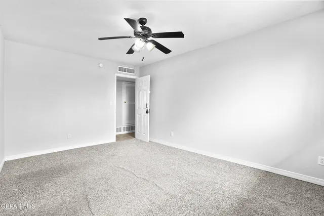 a view of bathroom with a toilet sink vanity and mirror
