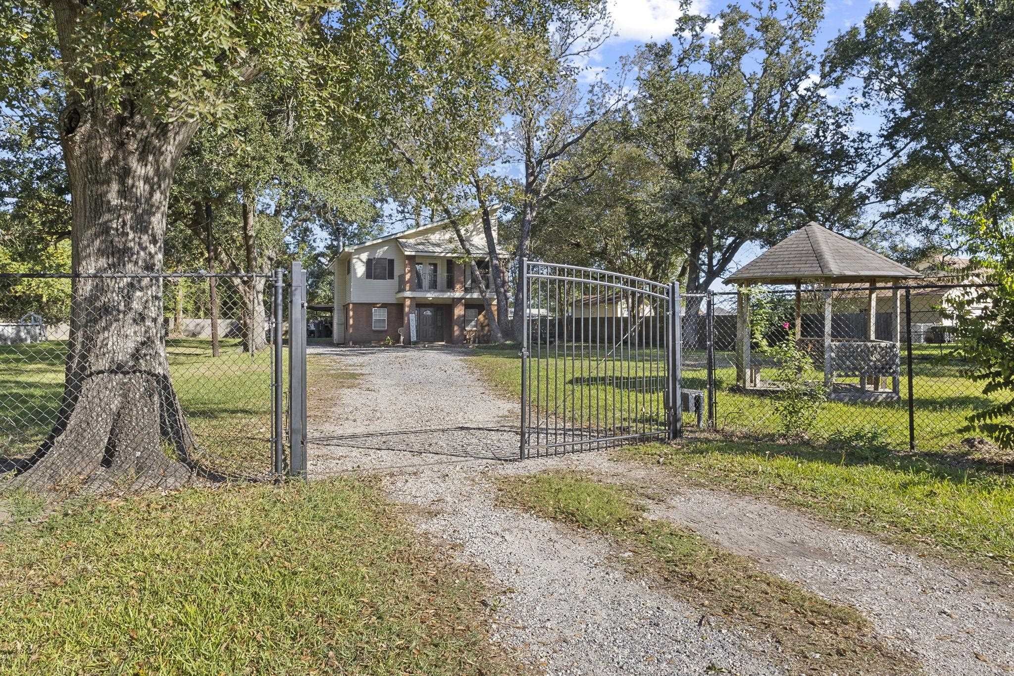770 Katherene Avenue Bridge City, TX 77611 - Photo 26 of 29 a view of a house with a backyard and a tree