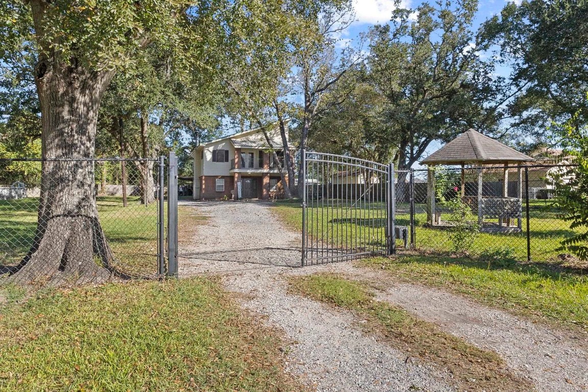 770 Katherene Avenue Bridge City, TX 77611 - Photo 28 of 29 a view of a house with a backyard and a tree