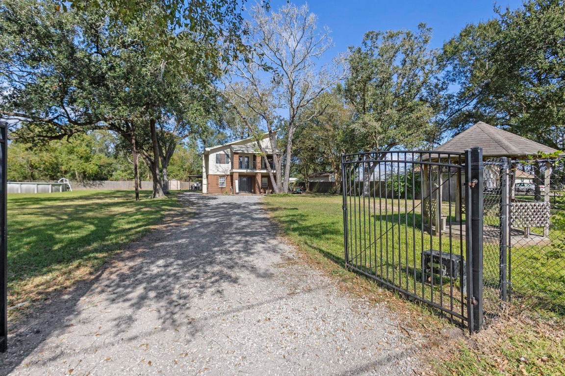 770 Katherene Avenue Bridge City, TX 77611 - Photo 3 of 29 a view of a garden with a trees and fence