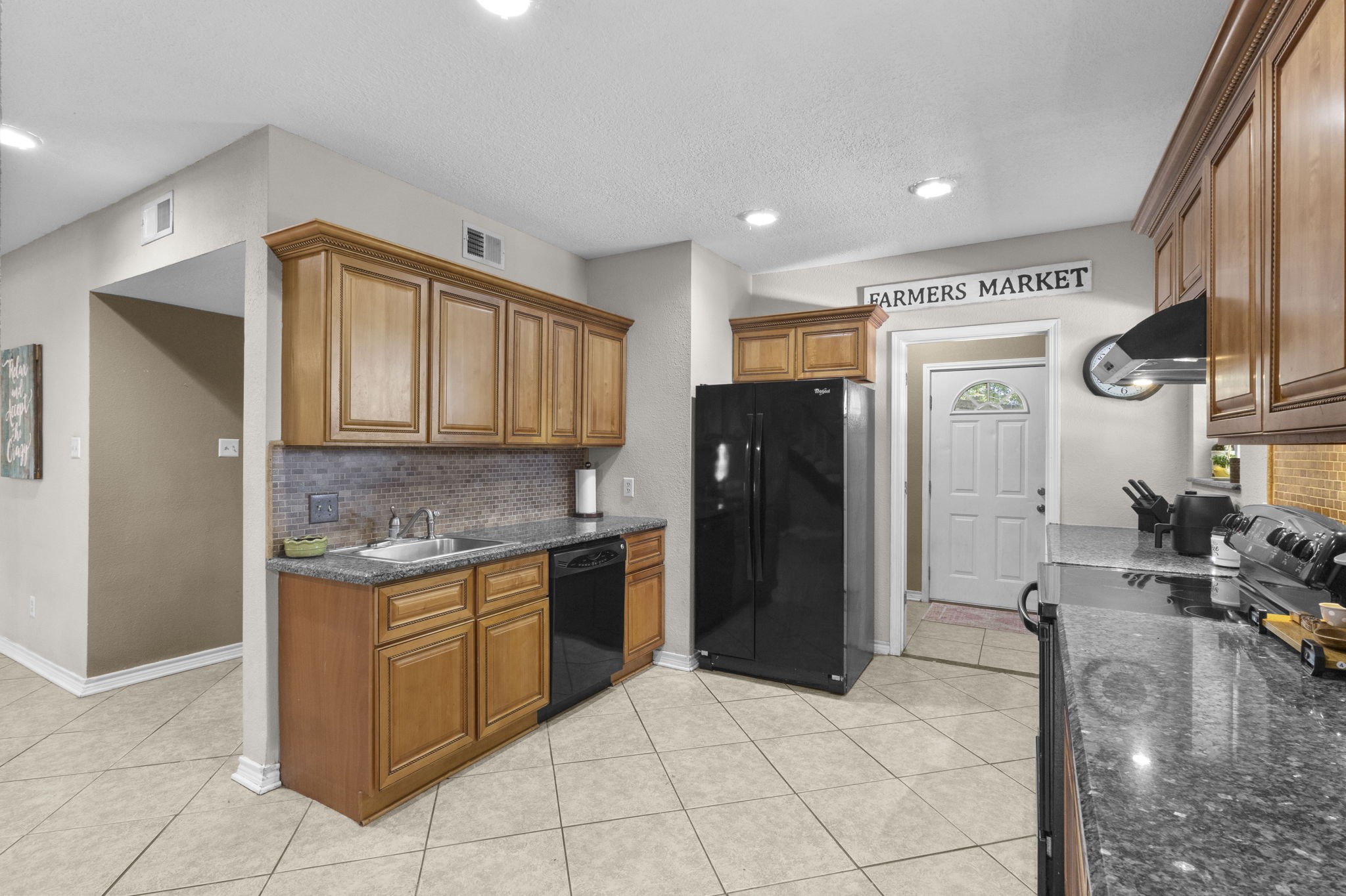 770 Katherene Avenue Bridge City, TX 77611 - Photo 7 of 29 a kitchen with stainless steel appliances granite countertop a refrigerator and a sink
