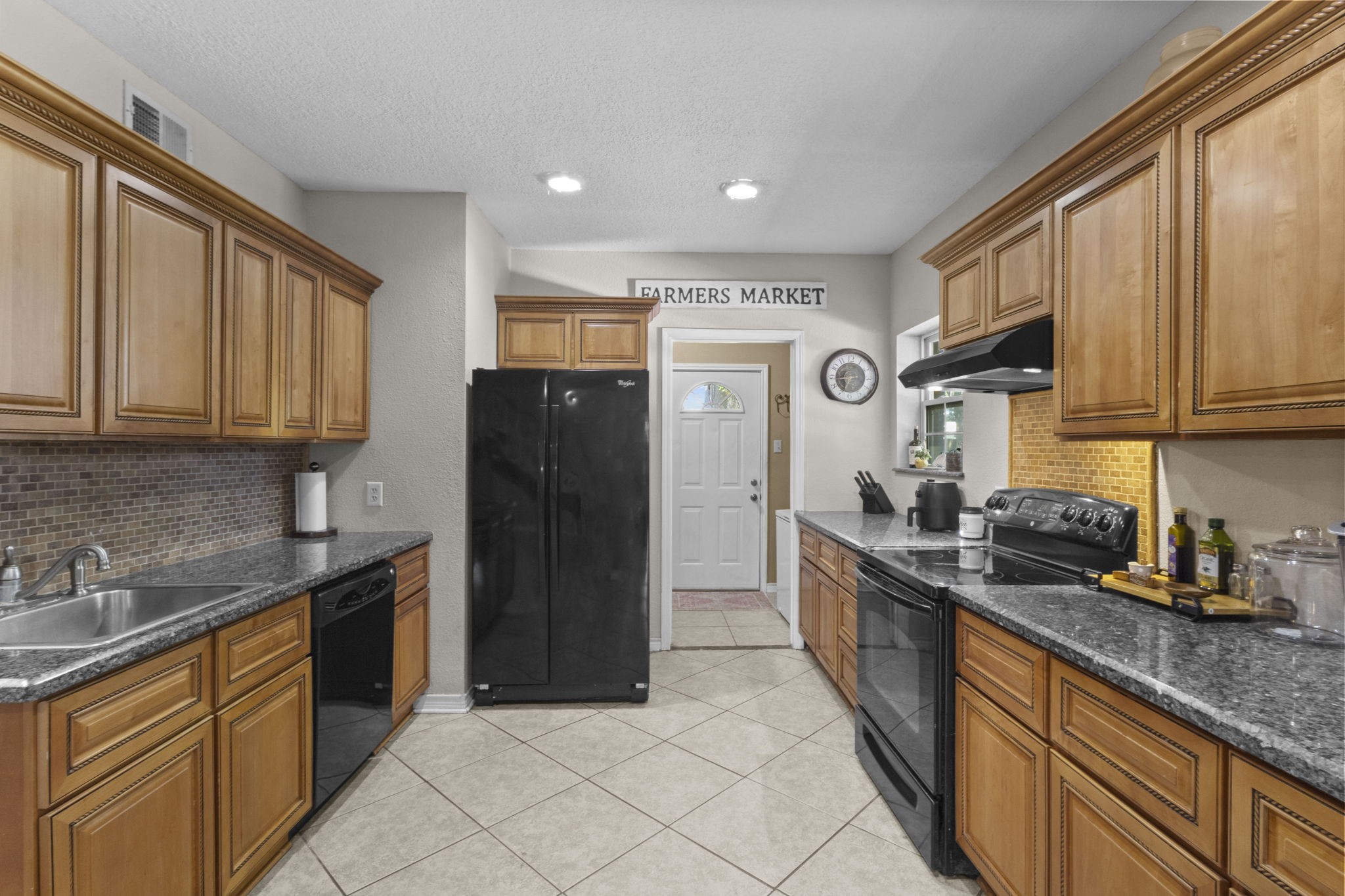 770 Katherene Avenue Bridge City, TX 77611 - Photo 8 of 29 a kitchen with stainless steel appliances granite countertop a refrigerator a sink dishwasher stove and oven