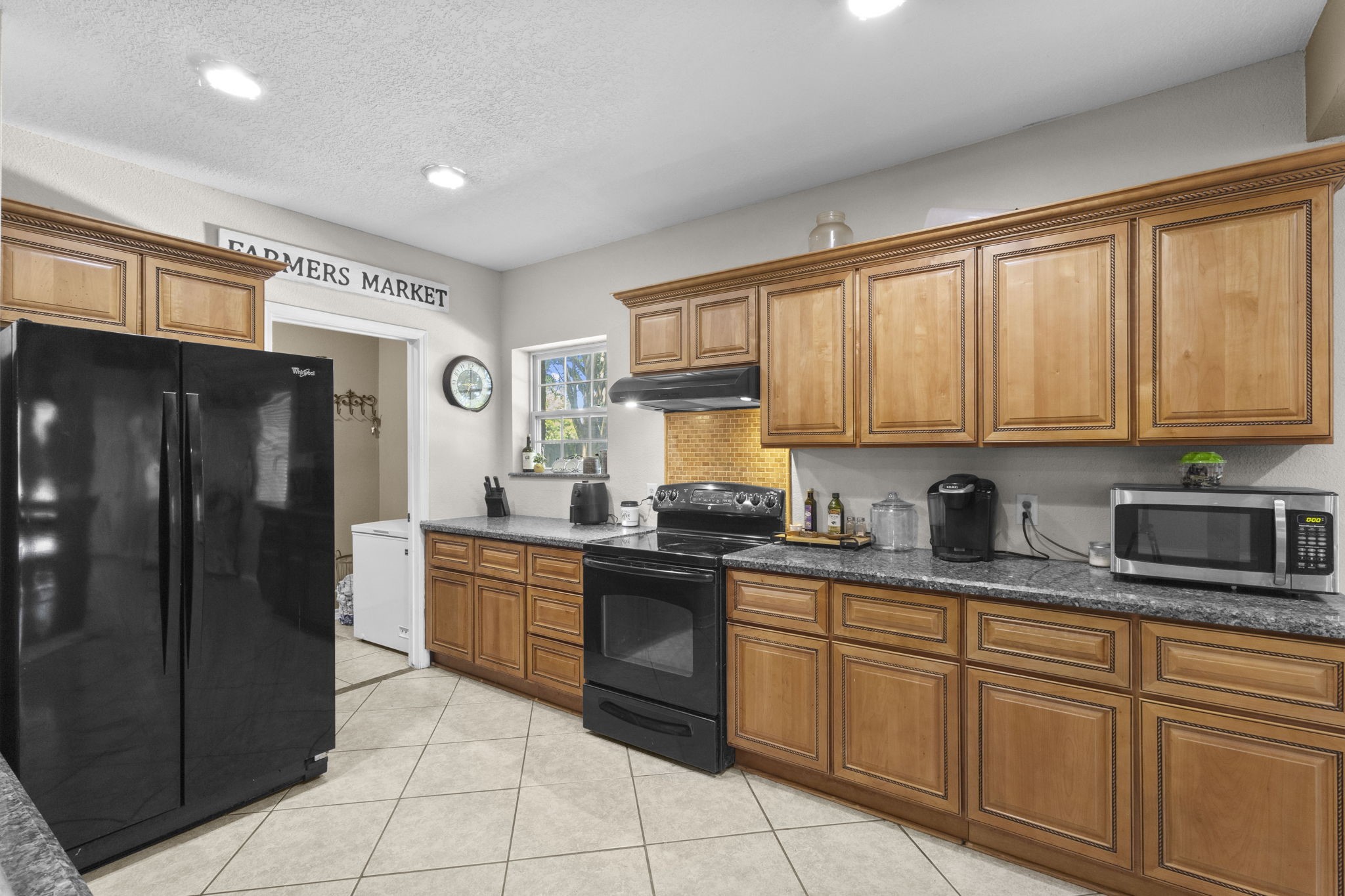 770 Katherene Avenue Bridge City, TX 77611 - Photo 9 of 29 a kitchen with stainless steel appliances granite countertop a refrigerator and sink