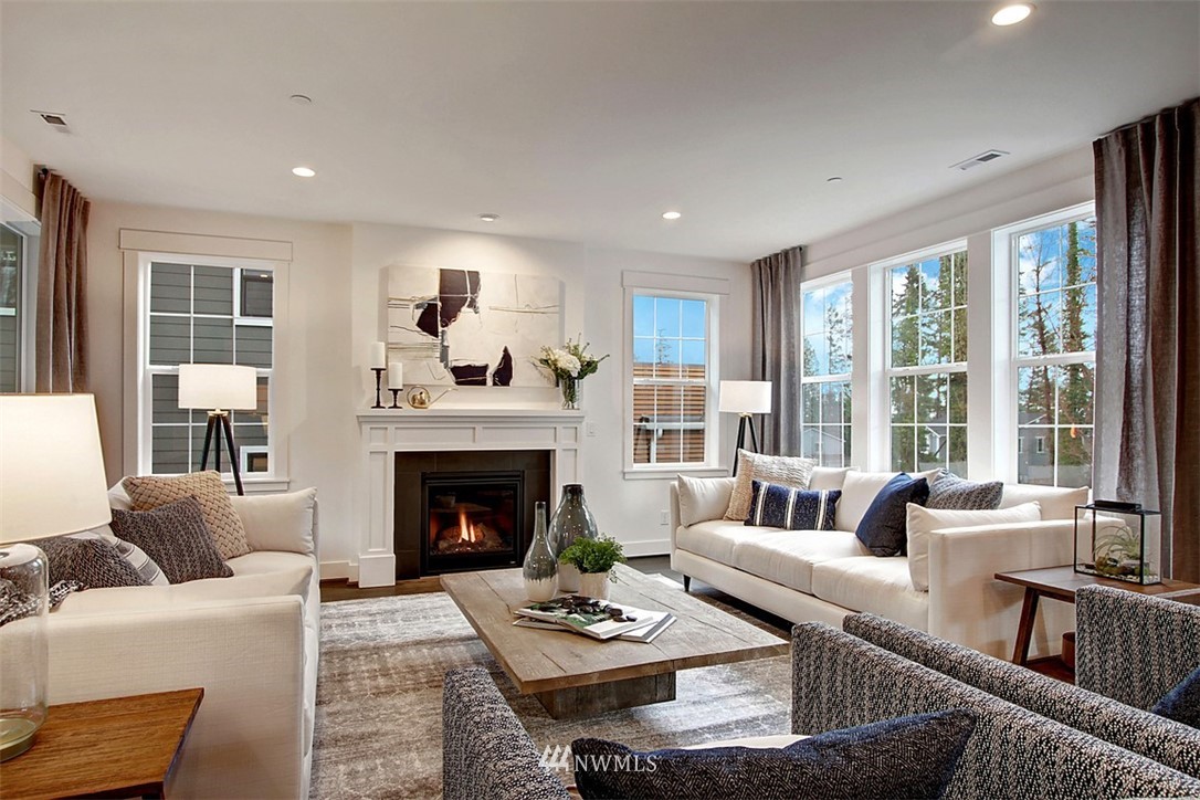 34 232nd Place Southeast Bothell, WA 98021 - Photo 3 of 26 a living room with furniture and a fireplace