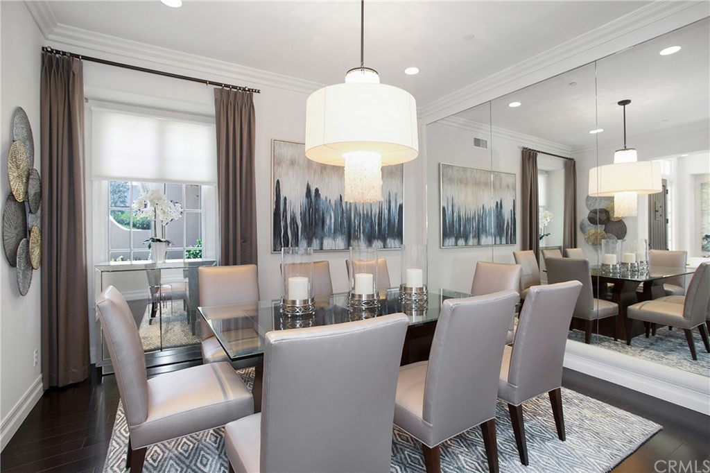 2395 Horizon Way Tustin, CA 92782 - Photo 11 of 39 a dining room with furniture a chandelier and wooden floor