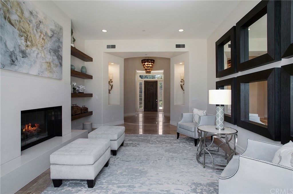 2395 Horizon Way Tustin, CA 92782 - Photo 13 of 39 a living room with furniture and a fireplace