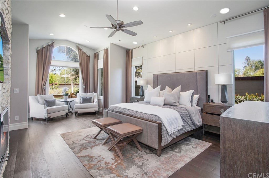 2395 Horizon Way Tustin, CA 92782 - Photo 14 of 39 a spacious bedroom with a bed and a couch