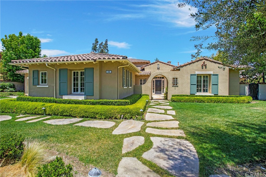 2395 Horizon Way Tustin, CA 92782 - Photo 2 of 39 a front view of a house with a garden