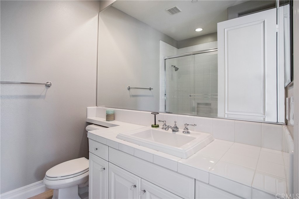 2395 Horizon Way Tustin, CA 92782 - Photo 21 of 39 a bathroom with a sink toilet and a mirror