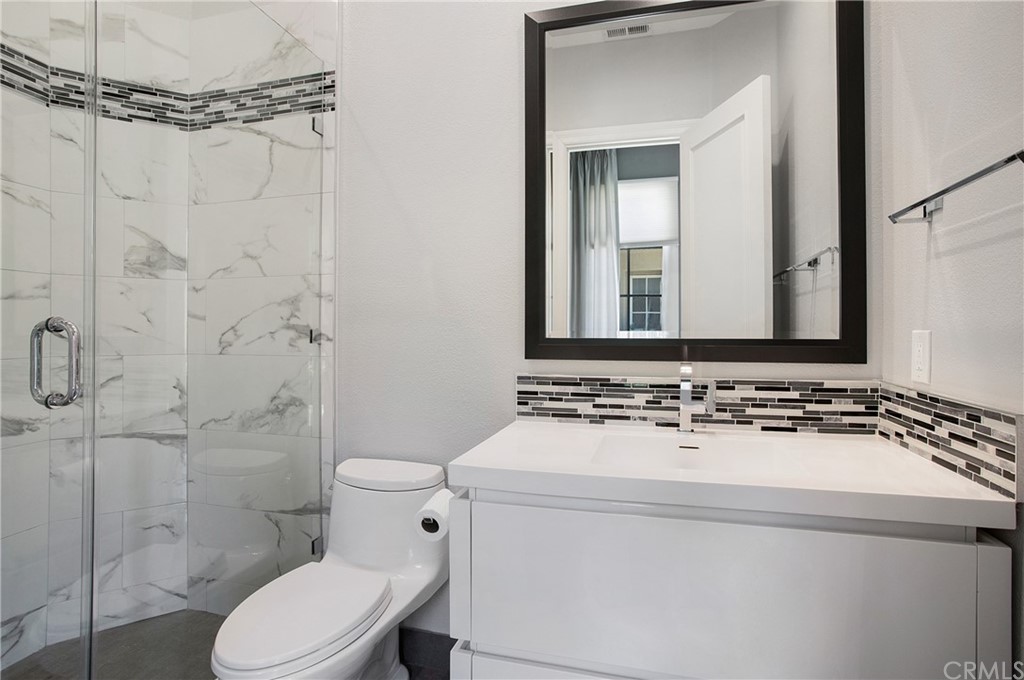 2395 Horizon Way Tustin, CA 92782 - Photo 23 of 39 a bathroom with a sink toilet and shower