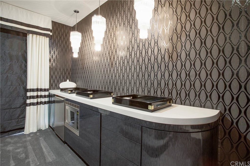 2395 Horizon Way Tustin, CA 92782 - Photo 30 of 39 a kitchen with a sink a stove and a chair