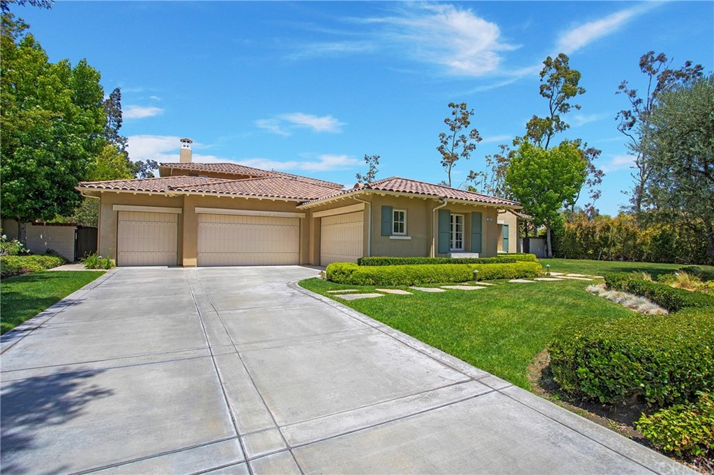 2395 Horizon Way Tustin, CA 92782 - Photo 3 of 39 a front view of a house with a yard