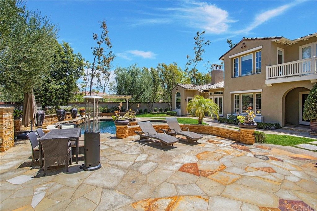 2395 Horizon Way Tustin, CA 92782 - Photo 32 of 39 a view of a house with backyard porch and sitting area