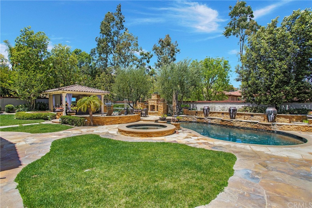 2395 Horizon Way Tustin, CA 92782 - Photo 33 of 39 a front view of a house with swimming pool having outdoor seating