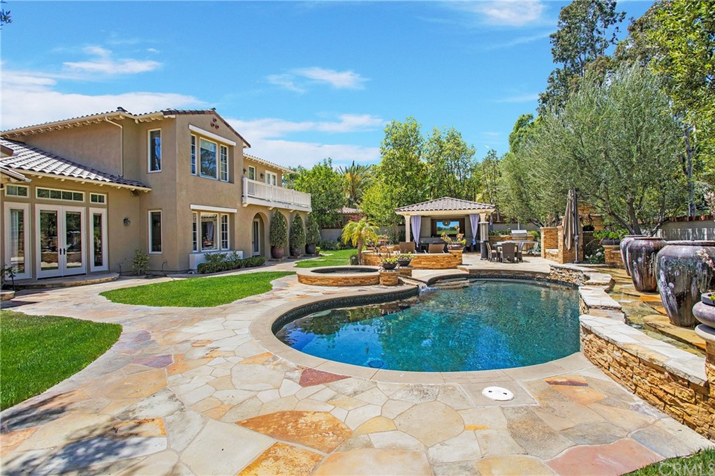 2395 Horizon Way Tustin, CA 92782 - Photo 34 of 39 a view of a house with swimming pool and a yard