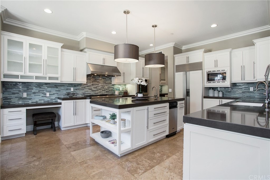 2395 Horizon Way Tustin, CA 92782 - Photo 5 of 39 a kitchen with stainless steel appliances granite countertop a stove a sink and a refrigerator