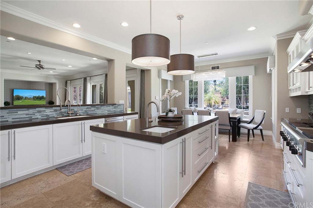 2395 Horizon Way Tustin, CA 92782 - Photo 6 of 39 a kitchen with stainless steel appliances granite countertop a sink a stove and a wooden floors