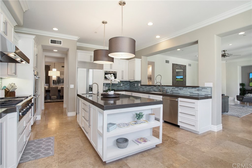 2395 Horizon Way Tustin, CA 92782 - Photo 7 of 39 a kitchen with stainless steel appliances granite countertop a sink and a stove