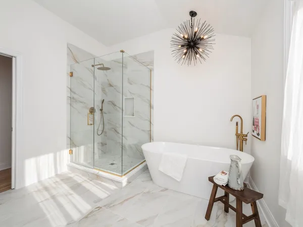 a bathroom with a bathtub and a shower