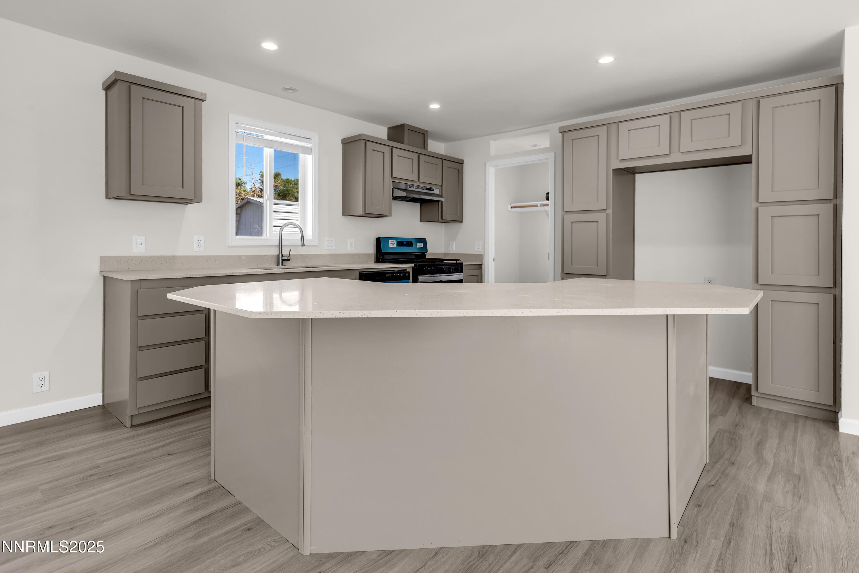 3810 Bobolink Circle Reno, NV 89508 - Photo 1 of 36 a kitchen with kitchen island a sink stainless steel appliances and cabinets