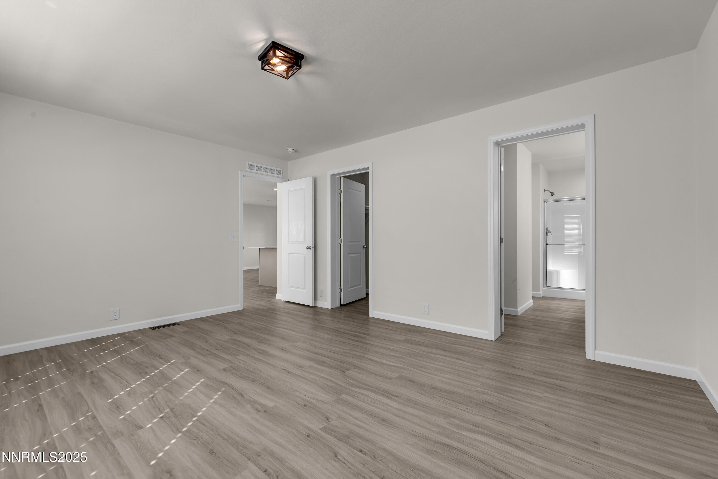 3810 Bobolink Circle Reno, NV 89508 - Photo 16 of 36 a view of an empty room with wooden floor and closet