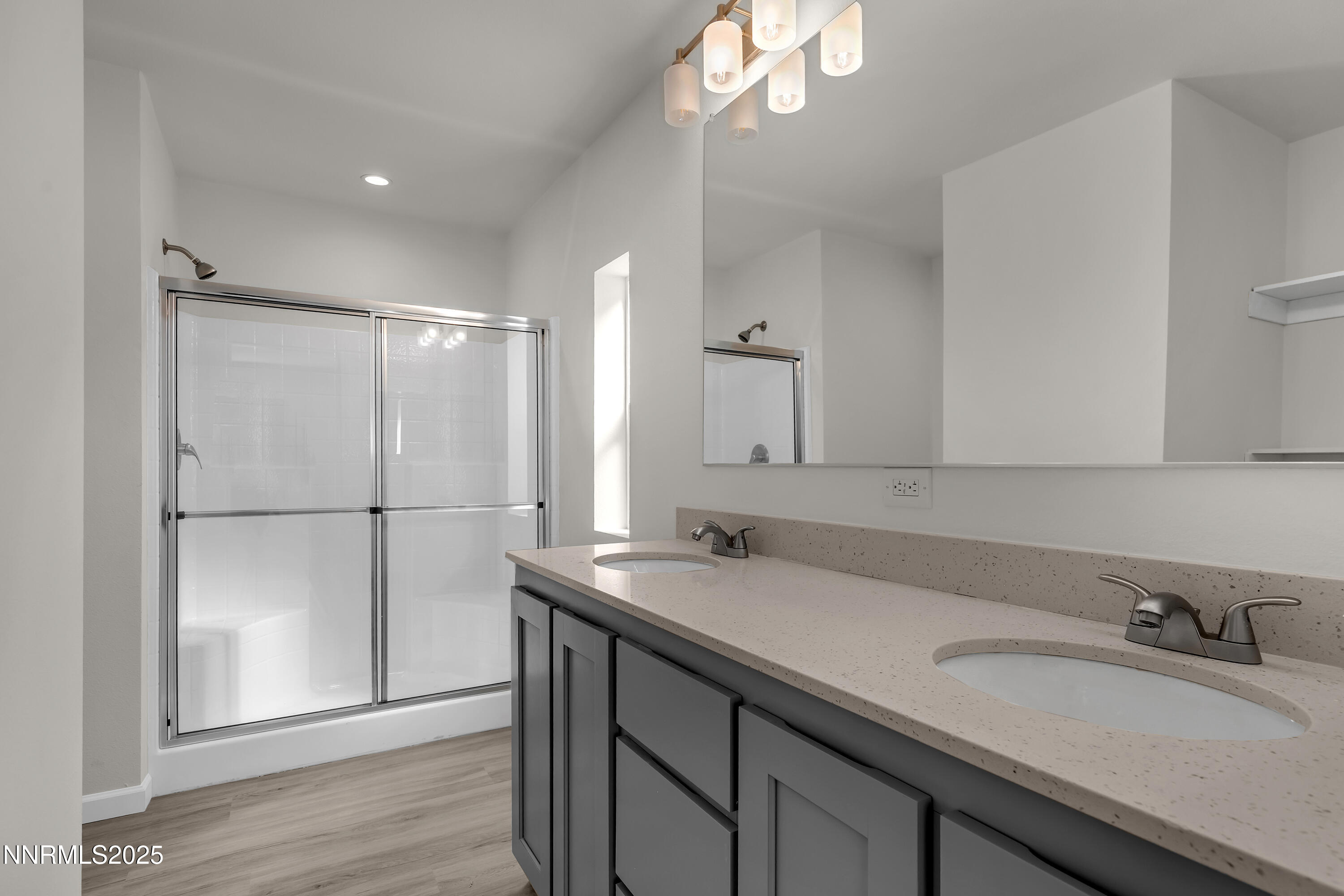 3810 Bobolink Circle Reno, NV 89508 - Photo 17 of 36 a bathroom with a sink and a mirror