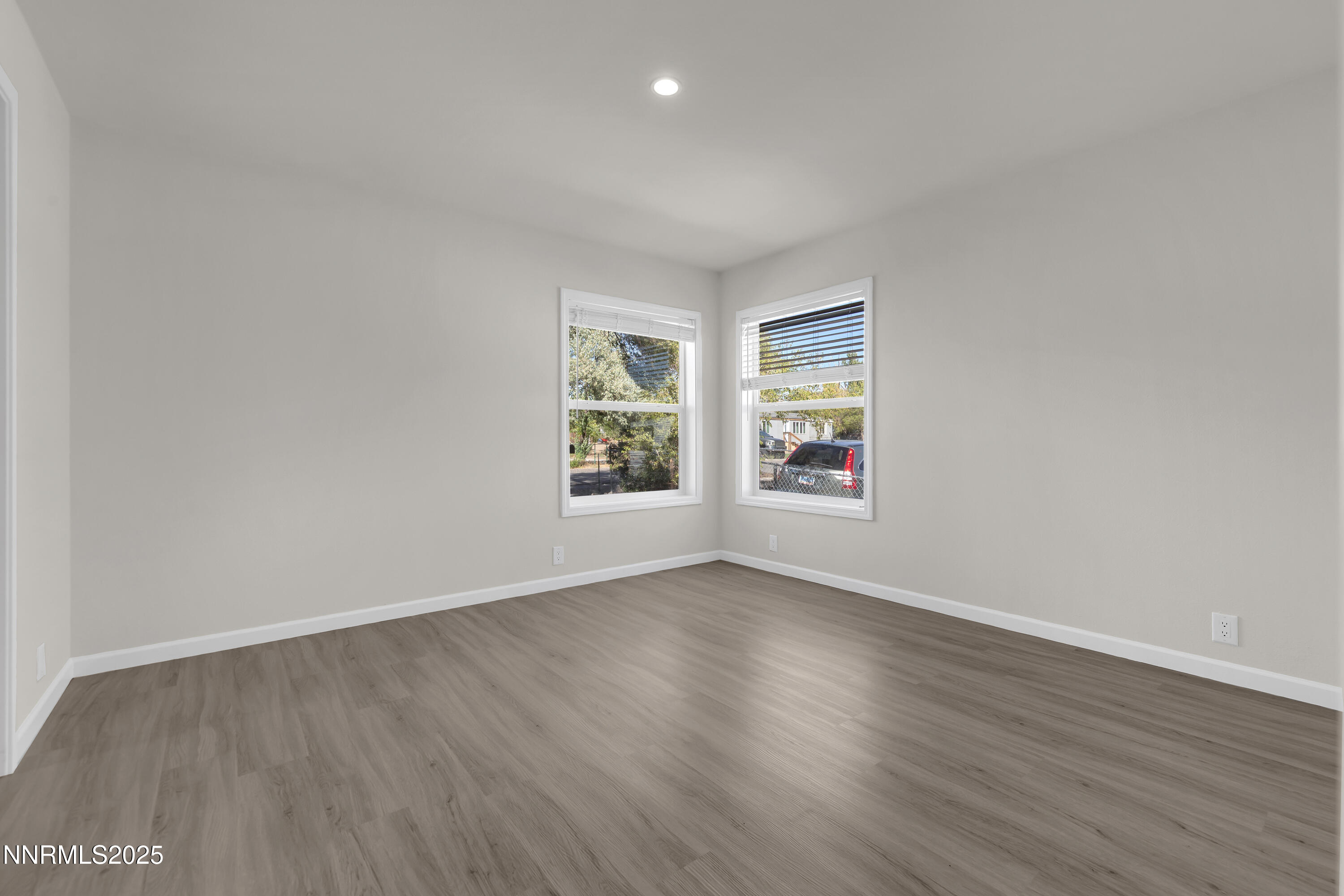 3810 Bobolink Circle Reno, NV 89508 - Photo 20 of 36 an empty room with wooden floor and windows