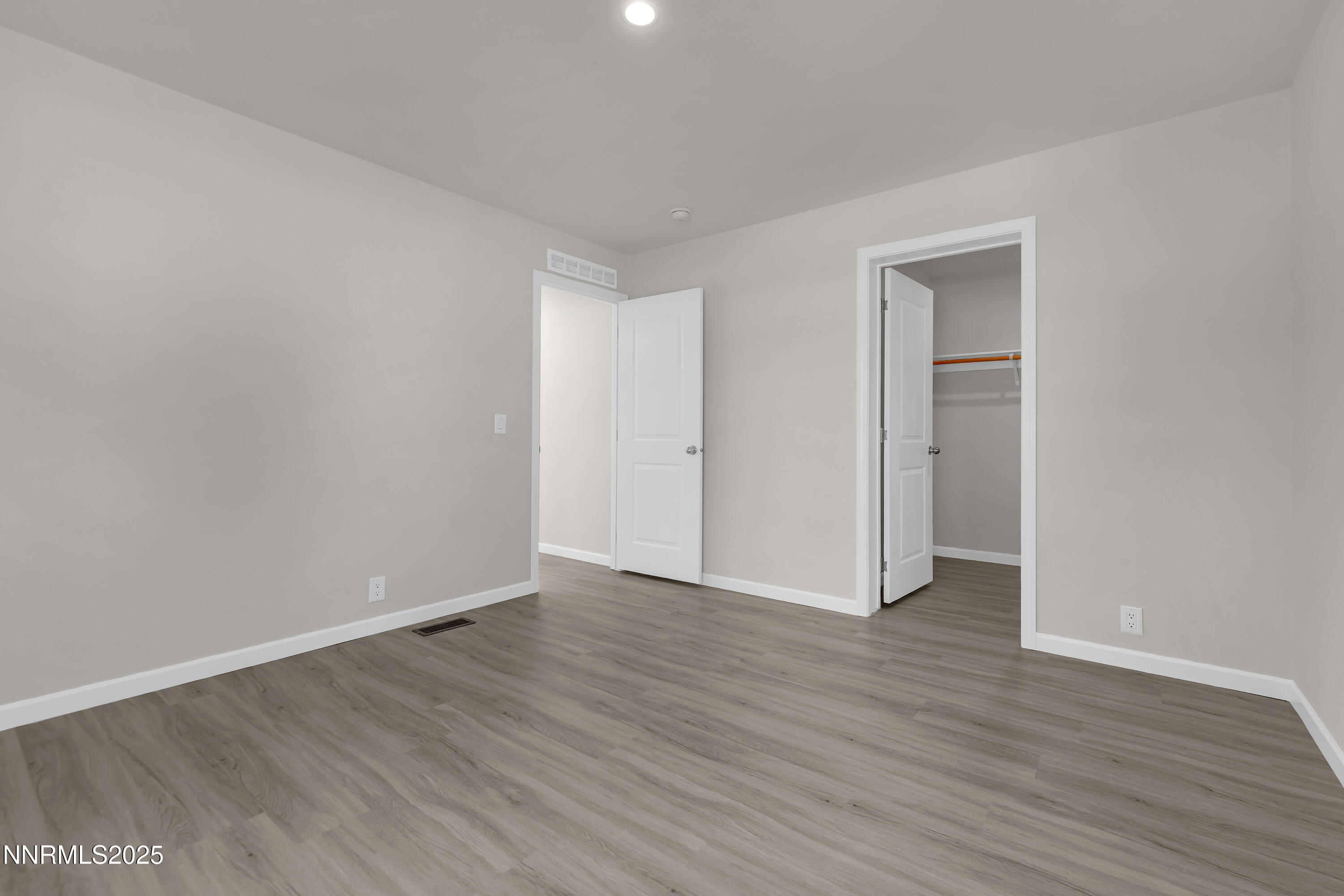 3810 Bobolink Circle Reno, NV 89508 - Photo 21 of 36 a view of an empty room with wooden floor and closet