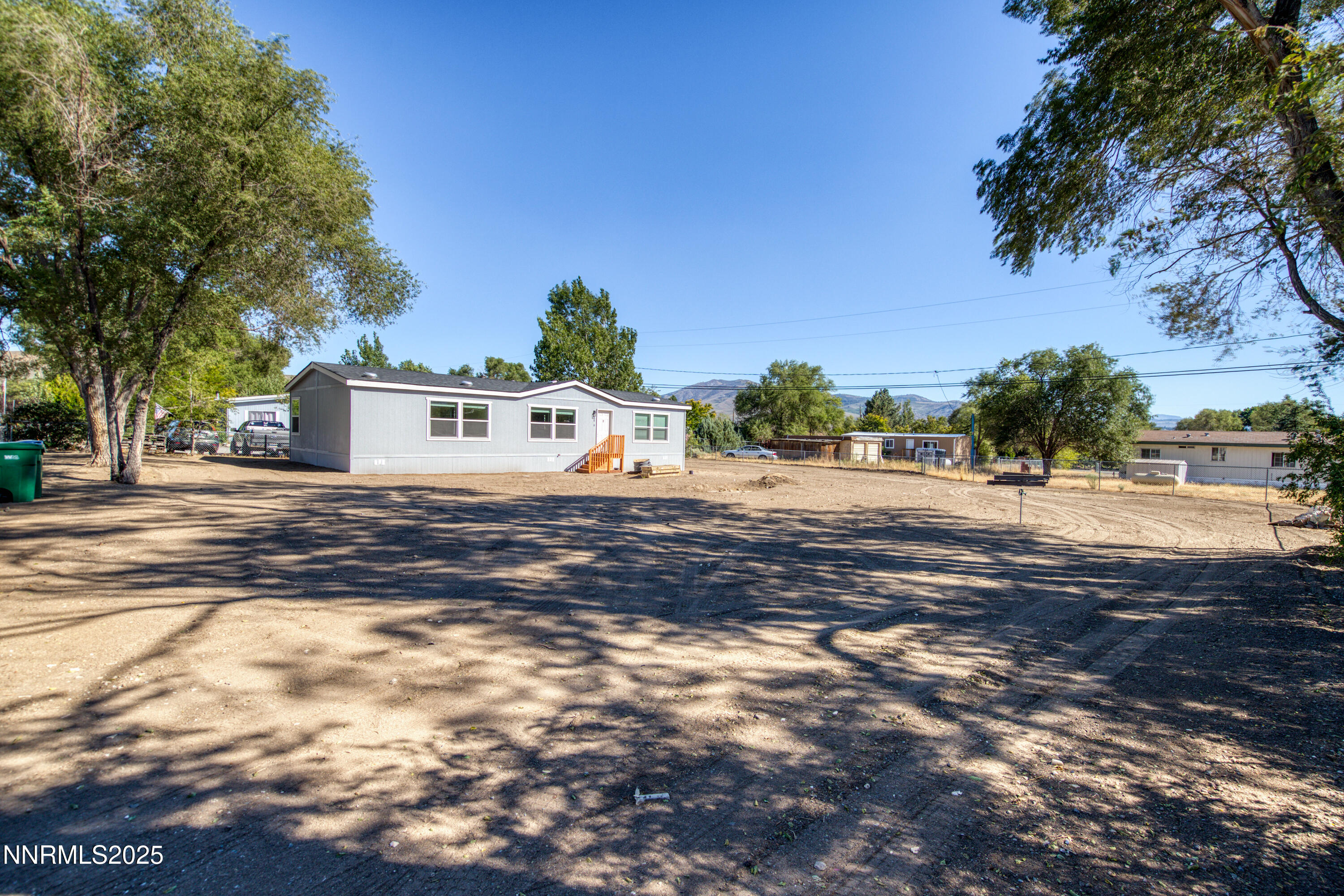 3810 Bobolink Circle Reno, NV 89508 - Photo 36 of 36 a view of a white house with a yard
