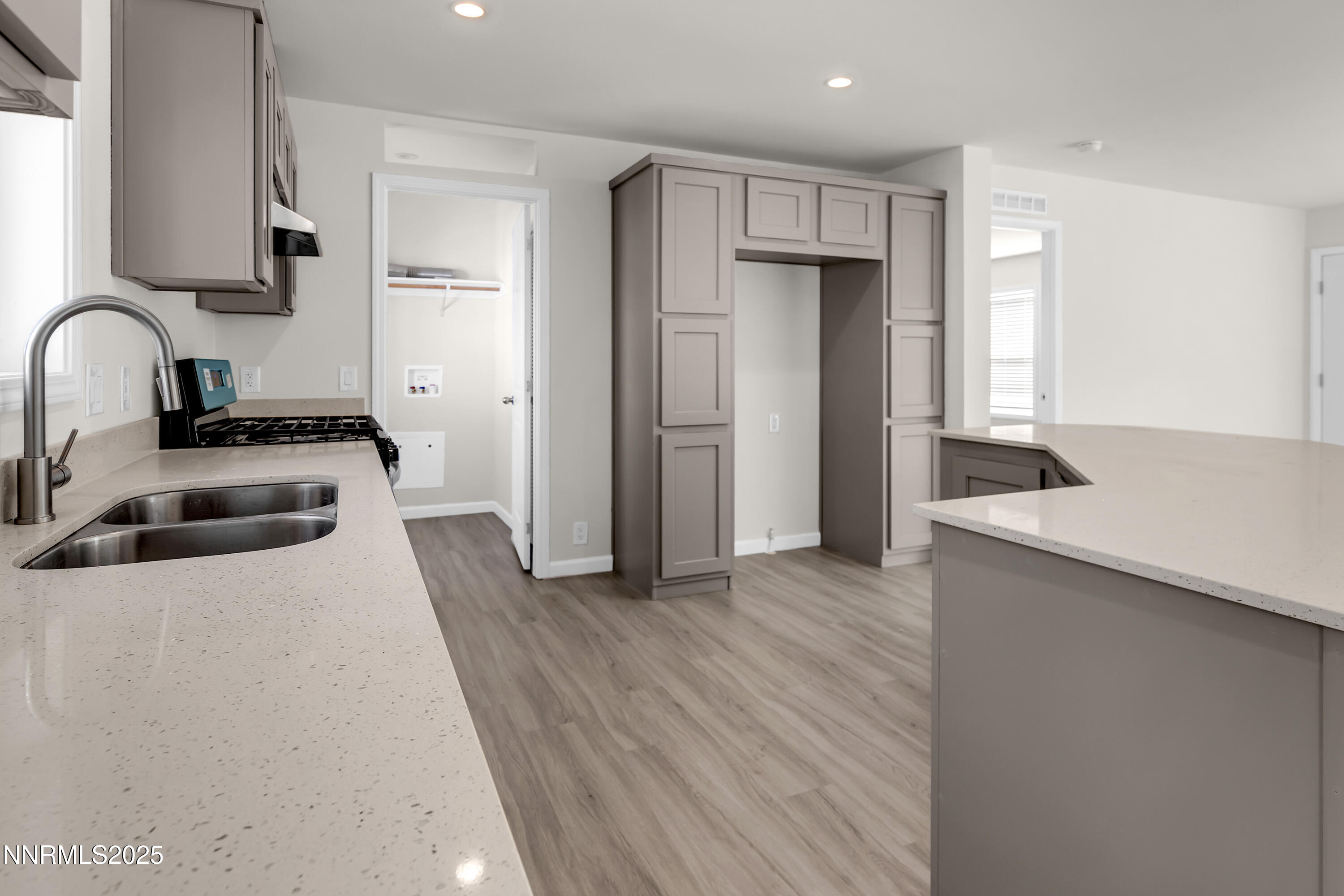 3810 Bobolink Circle Reno, NV 89508 - Photo 7 of 36 a kitchen with stainless steel appliances a refrigerator a sink a stove and cabinets