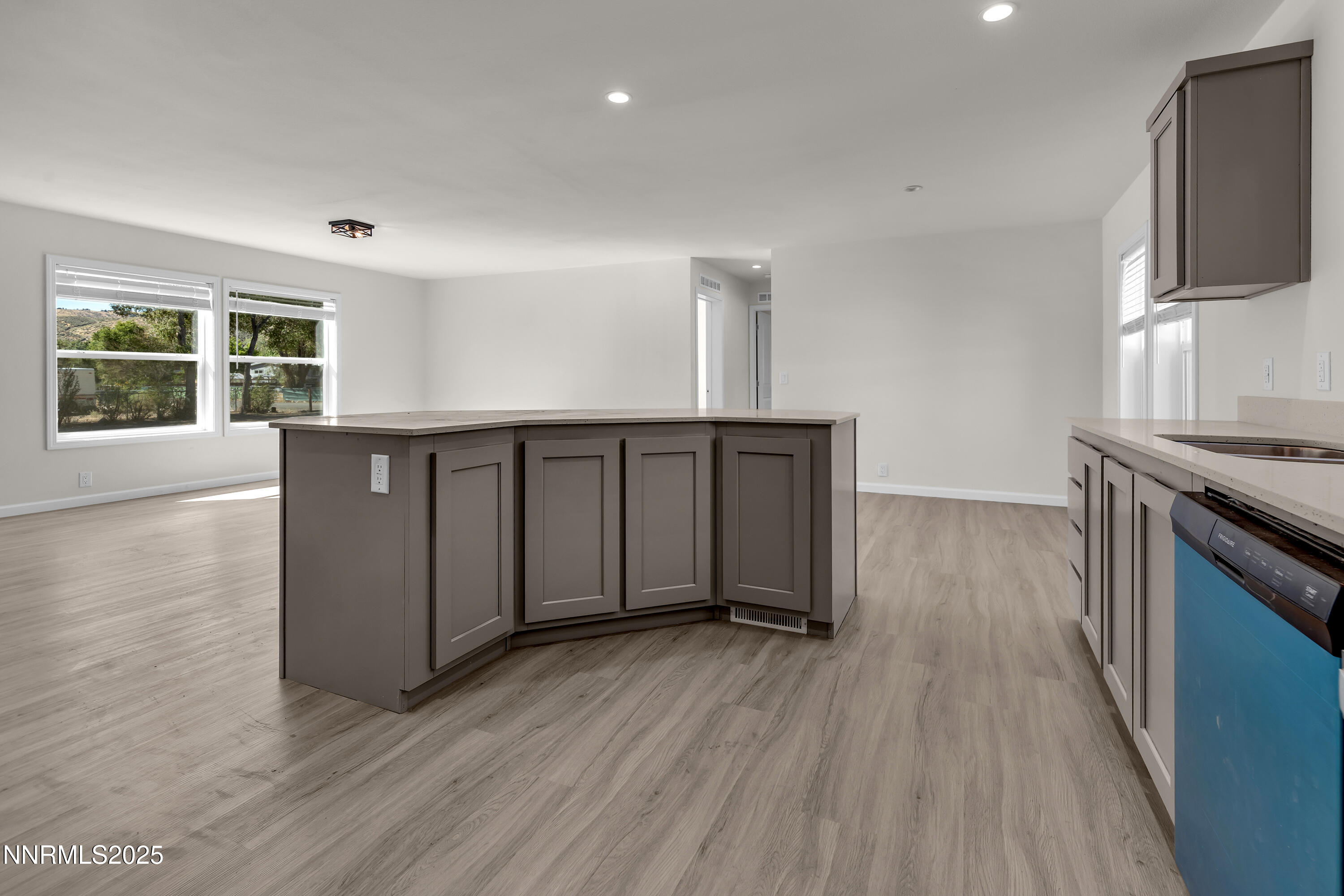 3810 Bobolink Circle Reno, NV 89508 - Photo 10 of 36 a view of a kitchen with wooden floor and a sink