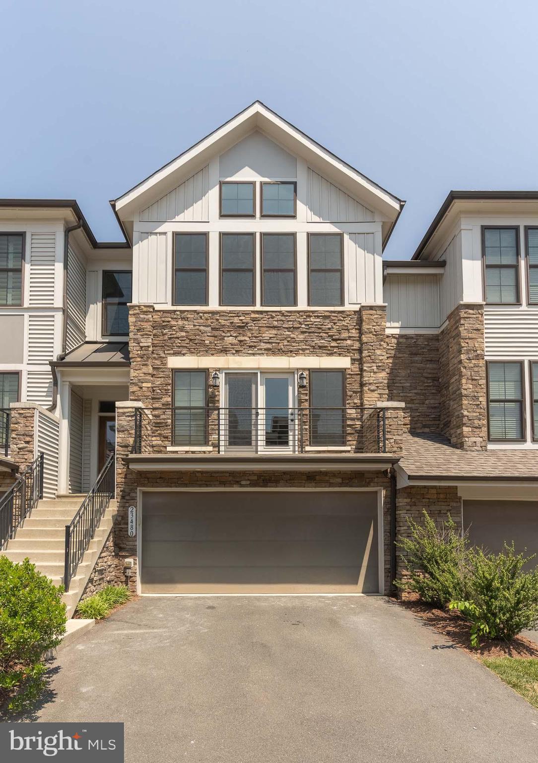 a front view of a house with a garage