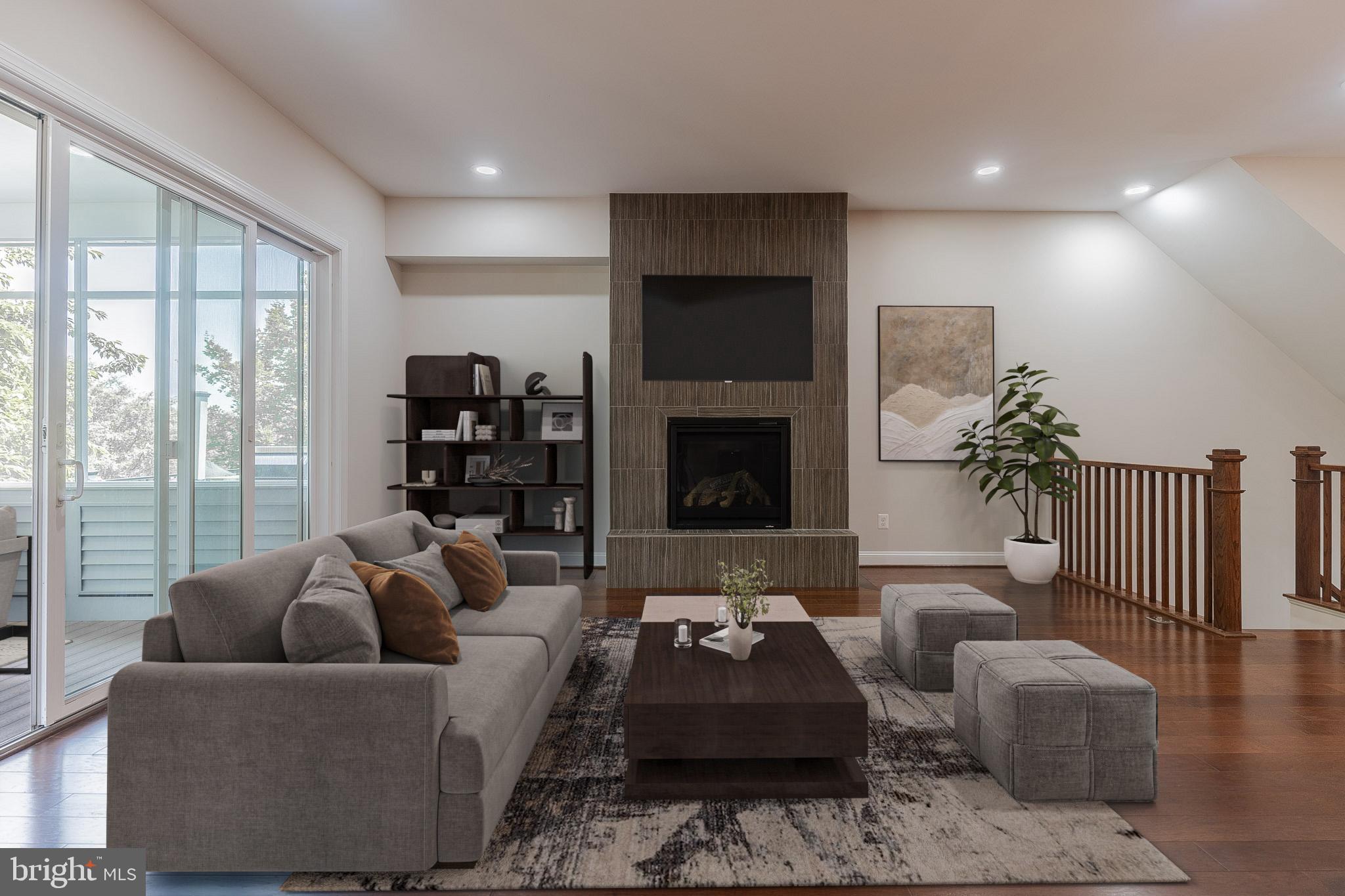 23480 Epperson Square Brambleton, VA 20148 - Photo 12 of 50 a living room with furniture fireplace and a large window