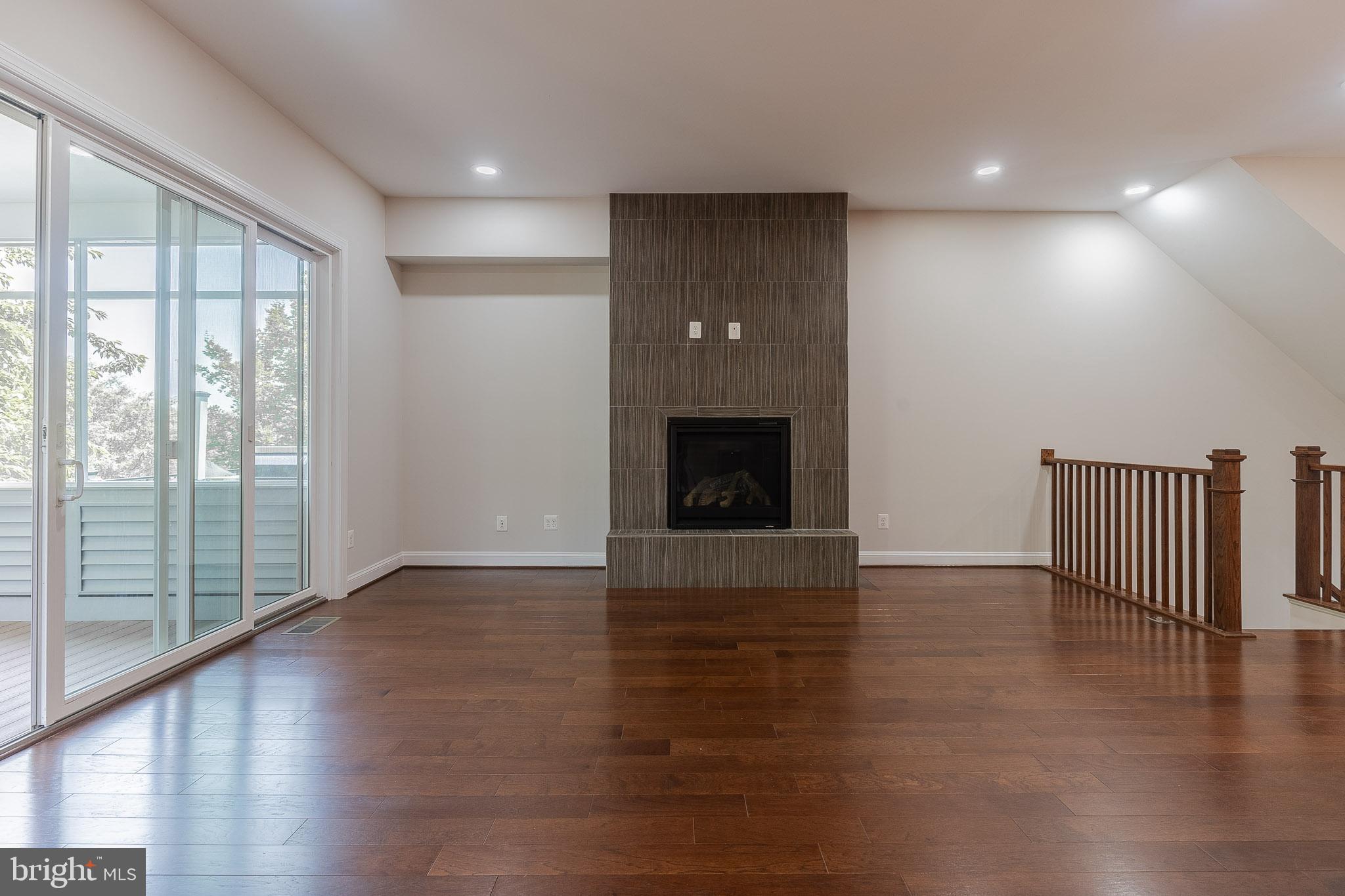 23480 Epperson Square Brambleton, VA 20148 - Photo 13 of 50 a view of an empty room with wooden floor and a window