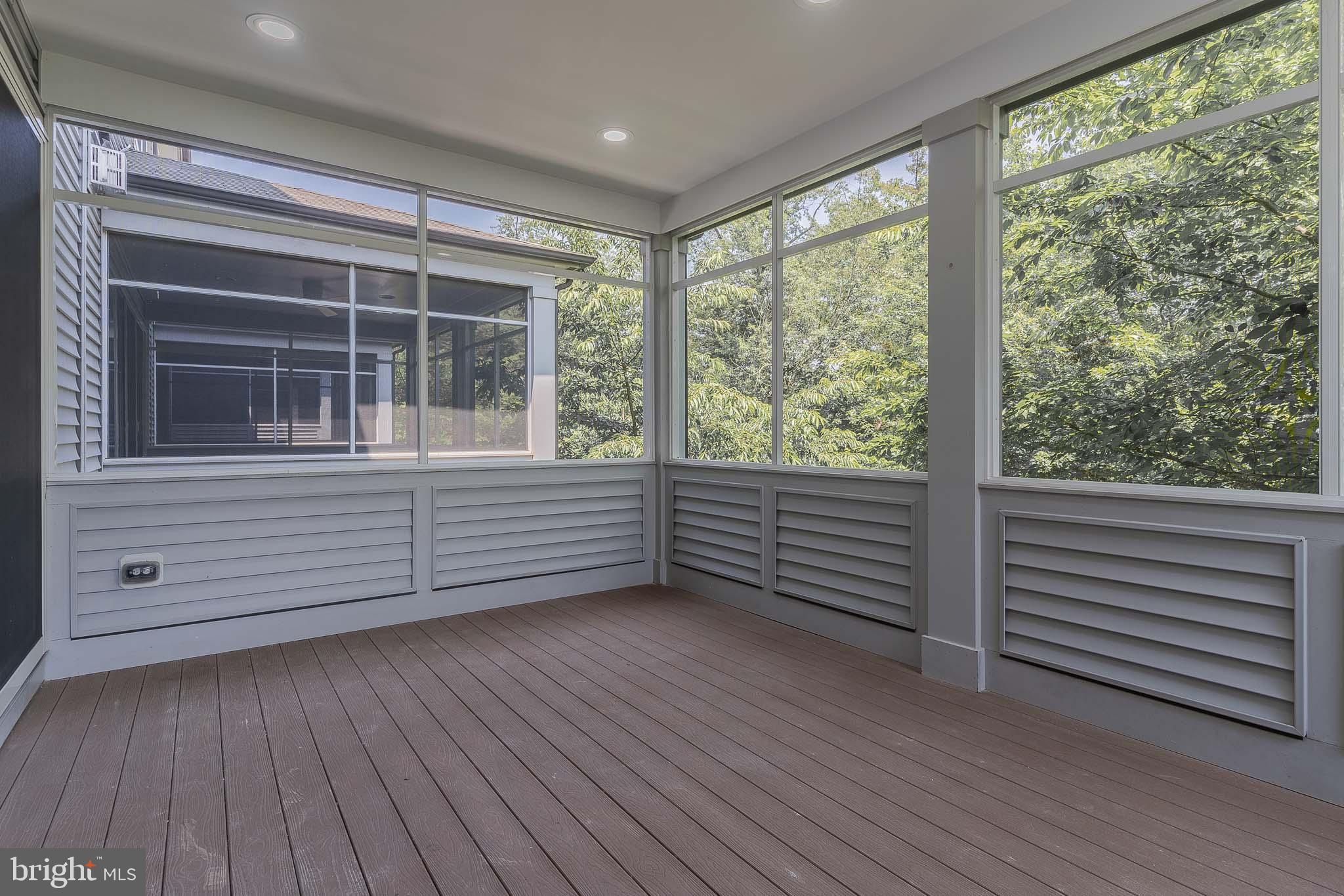 23480 Epperson Square Brambleton, VA 20148 - Photo 14 of 50 a view of an empty room with wooden floor and a window
