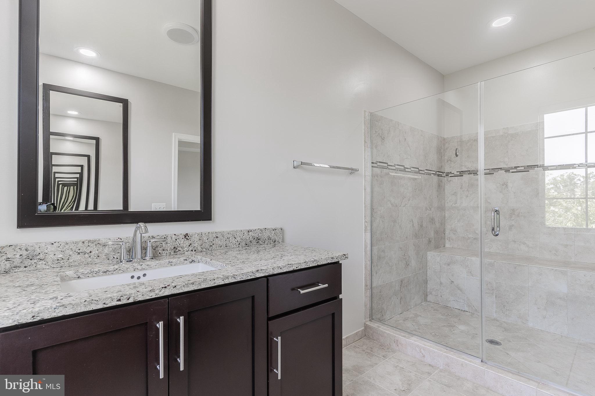 23480 Epperson Square Brambleton, VA 20148 - Photo 35 of 50 a bathroom with a granite countertop sink mirror and double