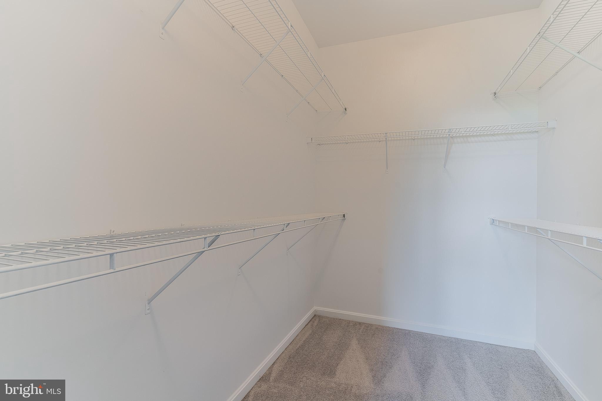 23480 Epperson Square Brambleton, VA 20148 - Photo 36 of 50 a view of a room with racks on the wall