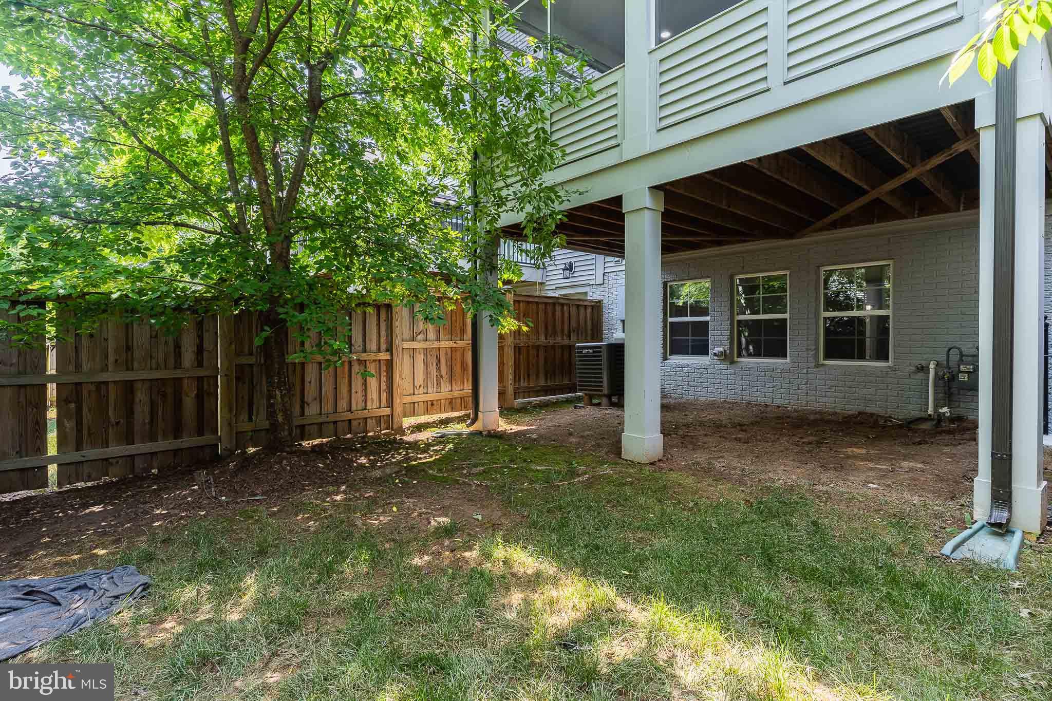 23480 Epperson Square Brambleton, VA 20148 - Photo 47 of 50 a view of a house with a yard