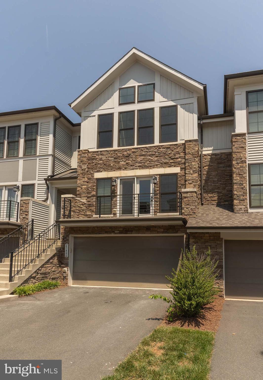 23480 Epperson Square Brambleton, VA 20148 - Photo 49 of 50 a front view of a house with balcony