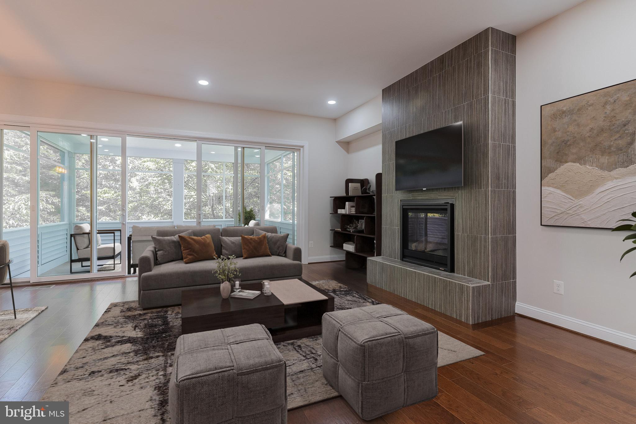 23480 Epperson Square Brambleton, VA 20148 - Photo 5 of 50 a living room with furniture and a flat screen tv