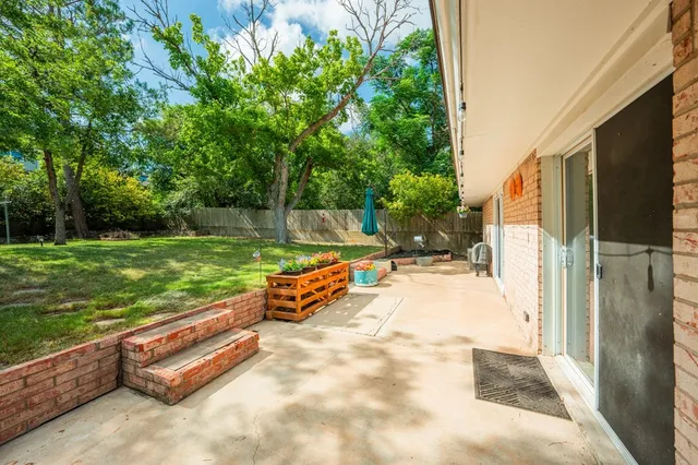 a view of backyard with outdoor area