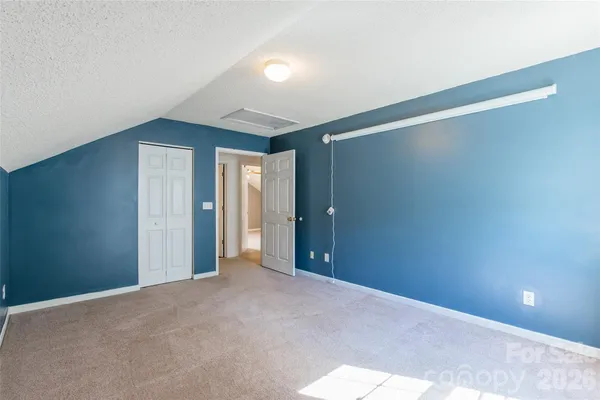 a view of a big room with an entryway