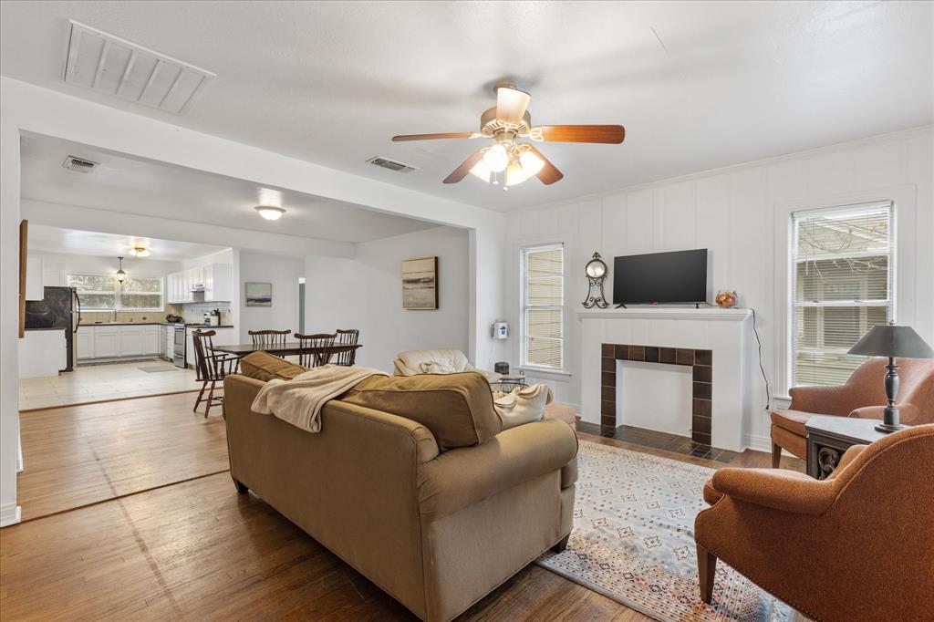 3554 Winston Road Fort Worth, TX 76109 - Photo 11 of 25 a living room with furniture a fireplace and a flat screen tv
