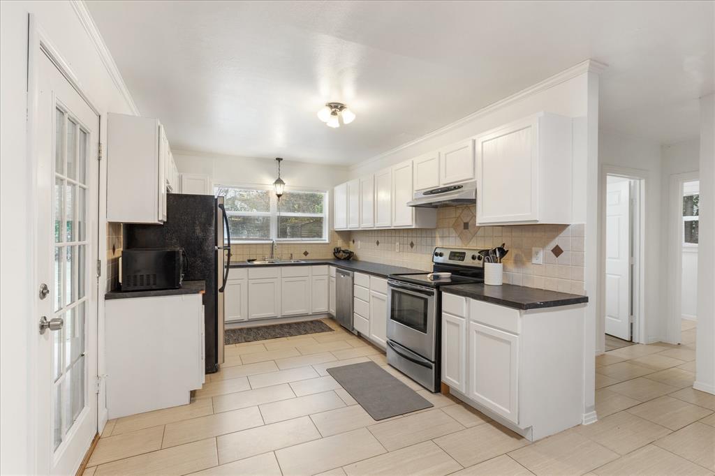 3554 Winston Road Fort Worth, TX 76109 - Photo 13 of 25 a kitchen with stainless steel appliances granite countertop a refrigerator oven a sink and dishwasher