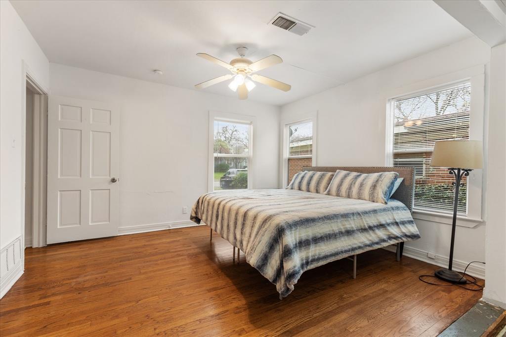 3554 Winston Road Fort Worth, TX 76109 - Photo 21 of 25 a spacious bedroom with a bed and a chandelier