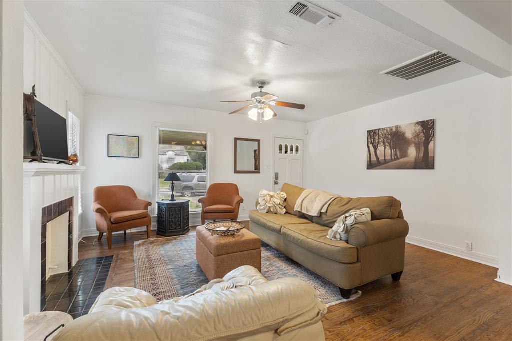 3554 Winston Road Fort Worth, TX 76109 - Photo 9 of 25 a living room with furniture a fireplace and a flat screen tv